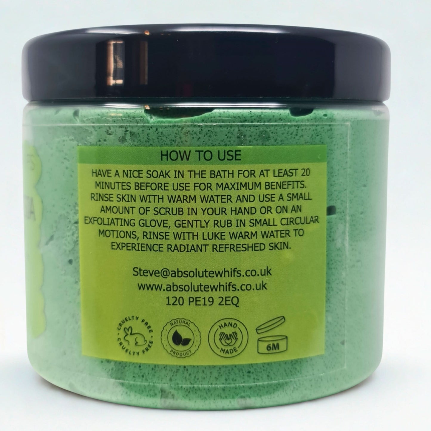Pear and freesia sugar body scrub in green jar with black lid showing usage instructions and natural ingredients icons