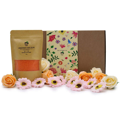 Luxury salt soak set with natural salts, essential oils, and flower petals in elegant gift packaging