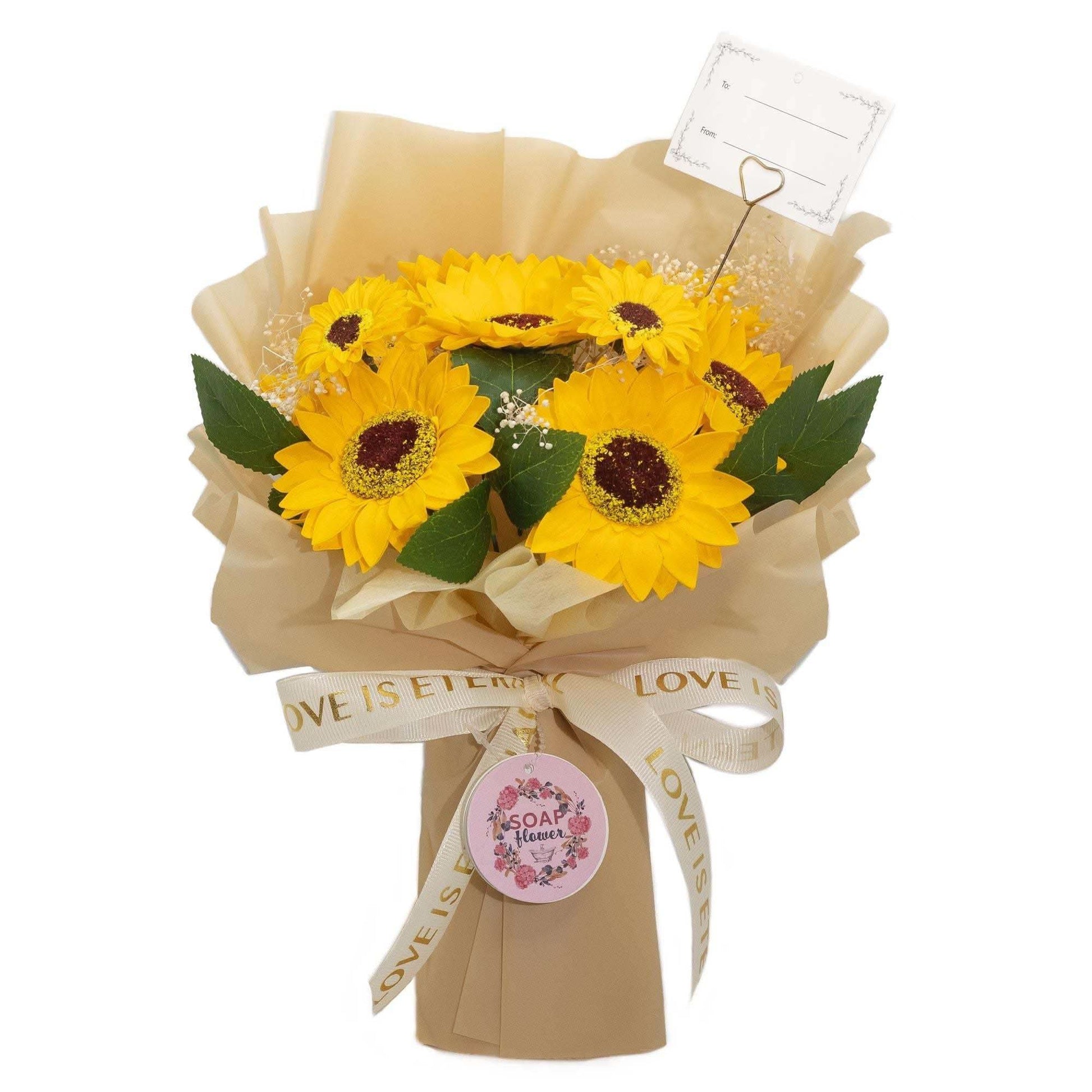 Large sunflowers bouquet with soap petals wrapped in golden paper and "Love is Eternal" ribbon, including a gift card.