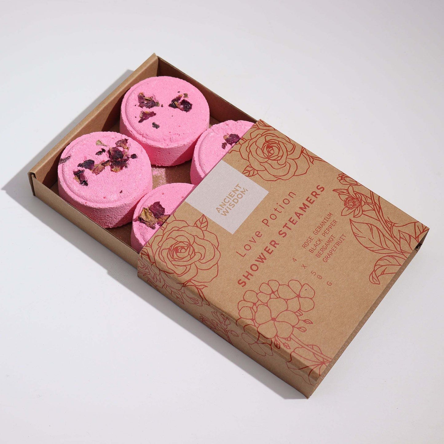 Zen Shower Steamers Love Potion gift set with pink essential oil steamers and rose petals in cardboard box