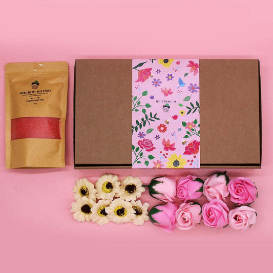 Salt Soak Set packaging with aromatic salt pouch and decorative flowers on pink background