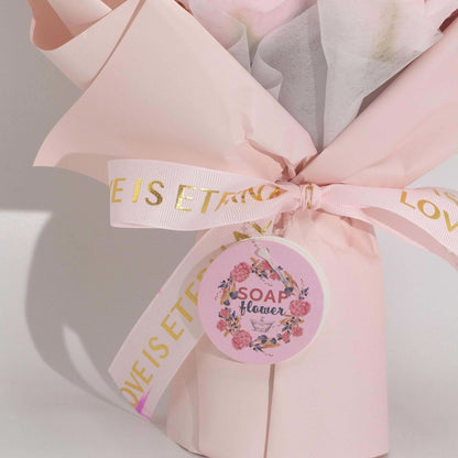 Large pink roses bouquet of soap flowers wrapped with love is eternal ribbon and gift card