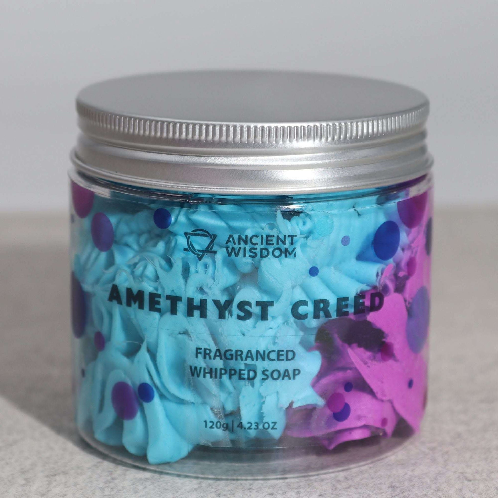 Amethyst Creed Whipped Soap in a clear jar with silver lid, blue and purple whipped texture inside, gentle masculine fragrance.