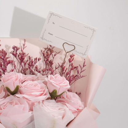 Large pink roses bouquet of soap petals wrapped in pale pink paper with satin ribbon and gift card