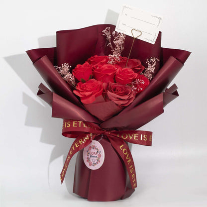 Large red soap roses bouquet wrapped in wine paper with Love is Eternal ribbon and gift card