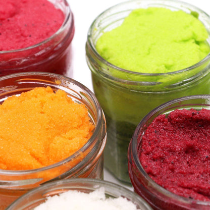 fragranced sugar body scrub jars in vibrant peach sangria and other colors