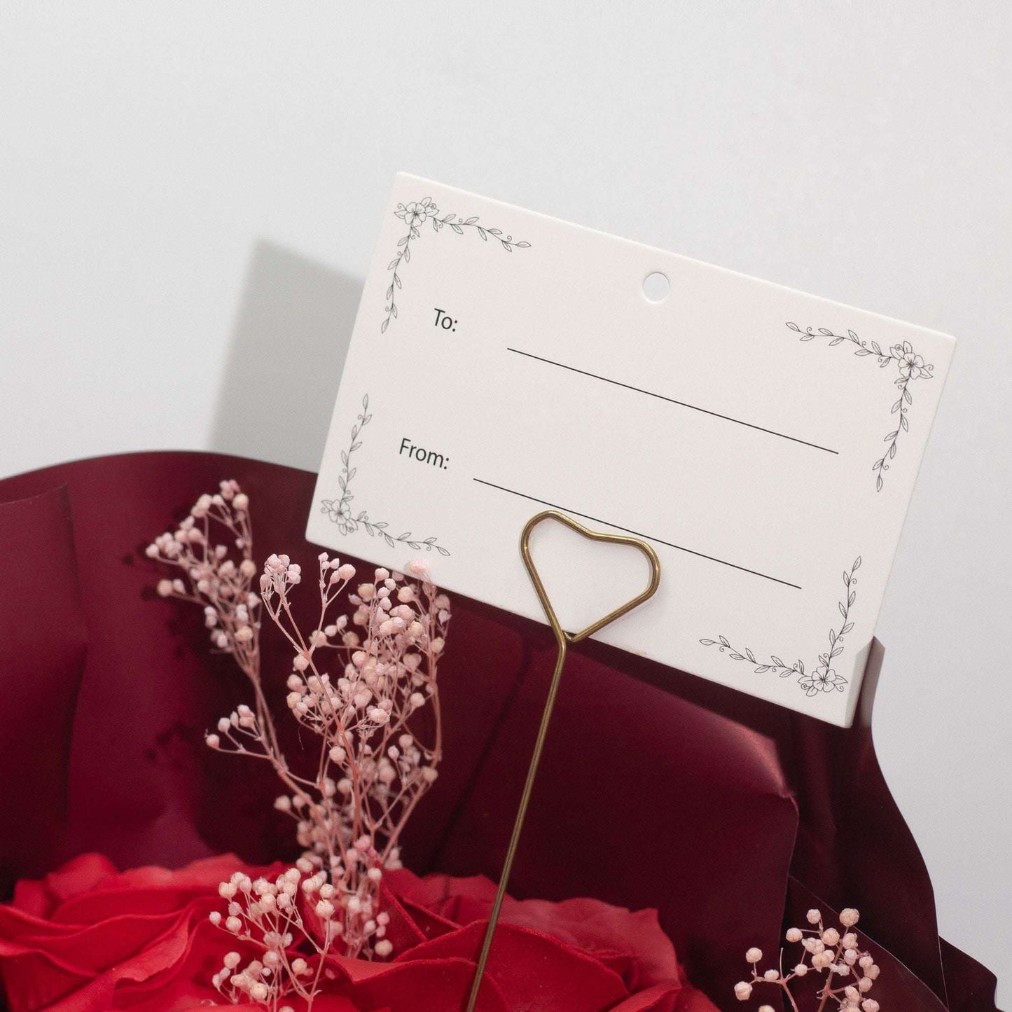 Large red soap roses bouquet wrapped in wine paper with Love is Eternal ribbon and gift card