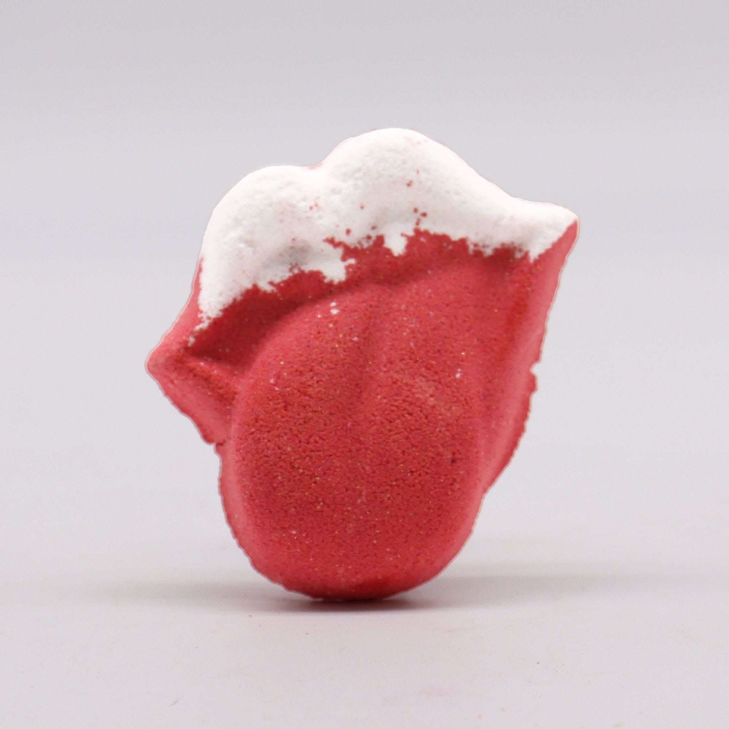 Red and white lips shaped bathbomb infused with raspberry and pomegranate scent weighing 60g