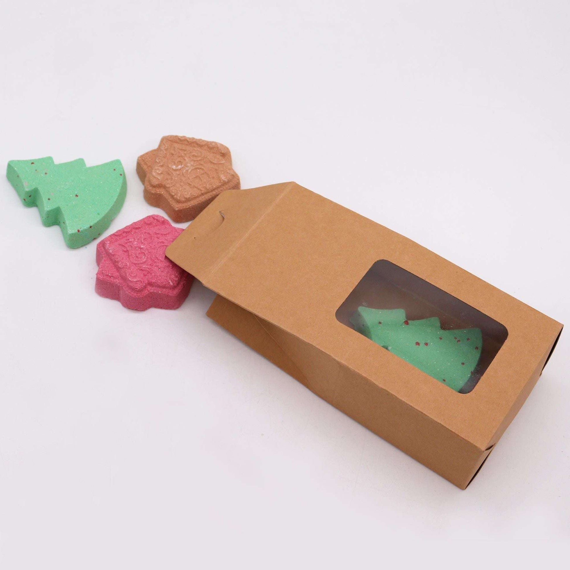 Gingerbread Town Christmas bath bomb gift pack with tree and house shapes in festive colors and eco-friendly box