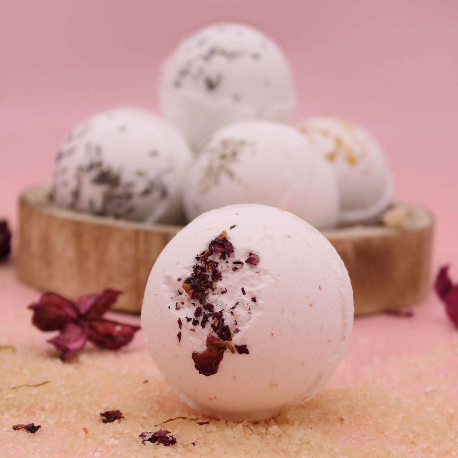 Sensual Himalayan Salt Bath Bomb with ylang ylang and coconut oil on pink background