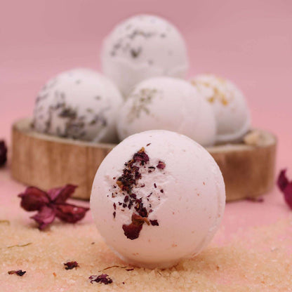 Sensual Himalayan Salt Bath Bomb with ylang ylang and coconut oil on pink background
