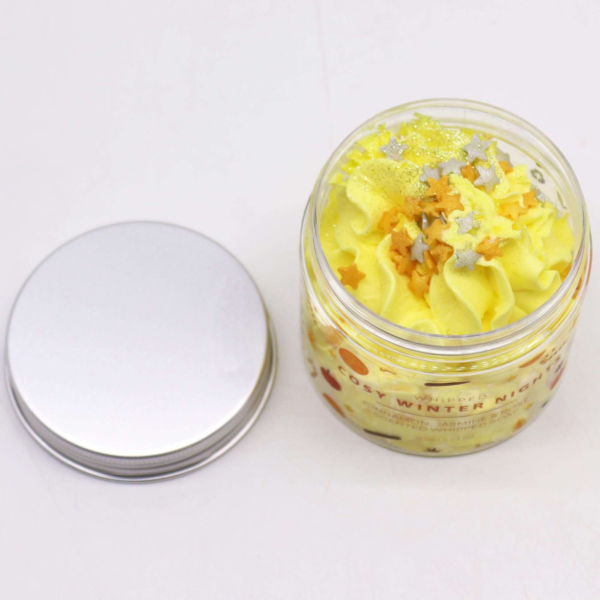Cosy Winter Nights whipped soap 120g with yellow swirl, glitter, and sugar star decorations in jar with silver lid