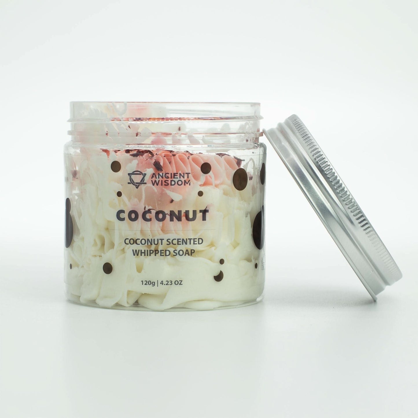 Coconut whipped soap with creamy texture and tropical scent in a clear jar with silver lid