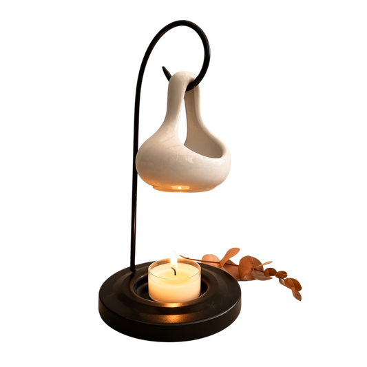beautiful 2-piece hanging tear-shaped ceramic burner in glossy ivory ceramic, suspended above a candle on a black metal stand