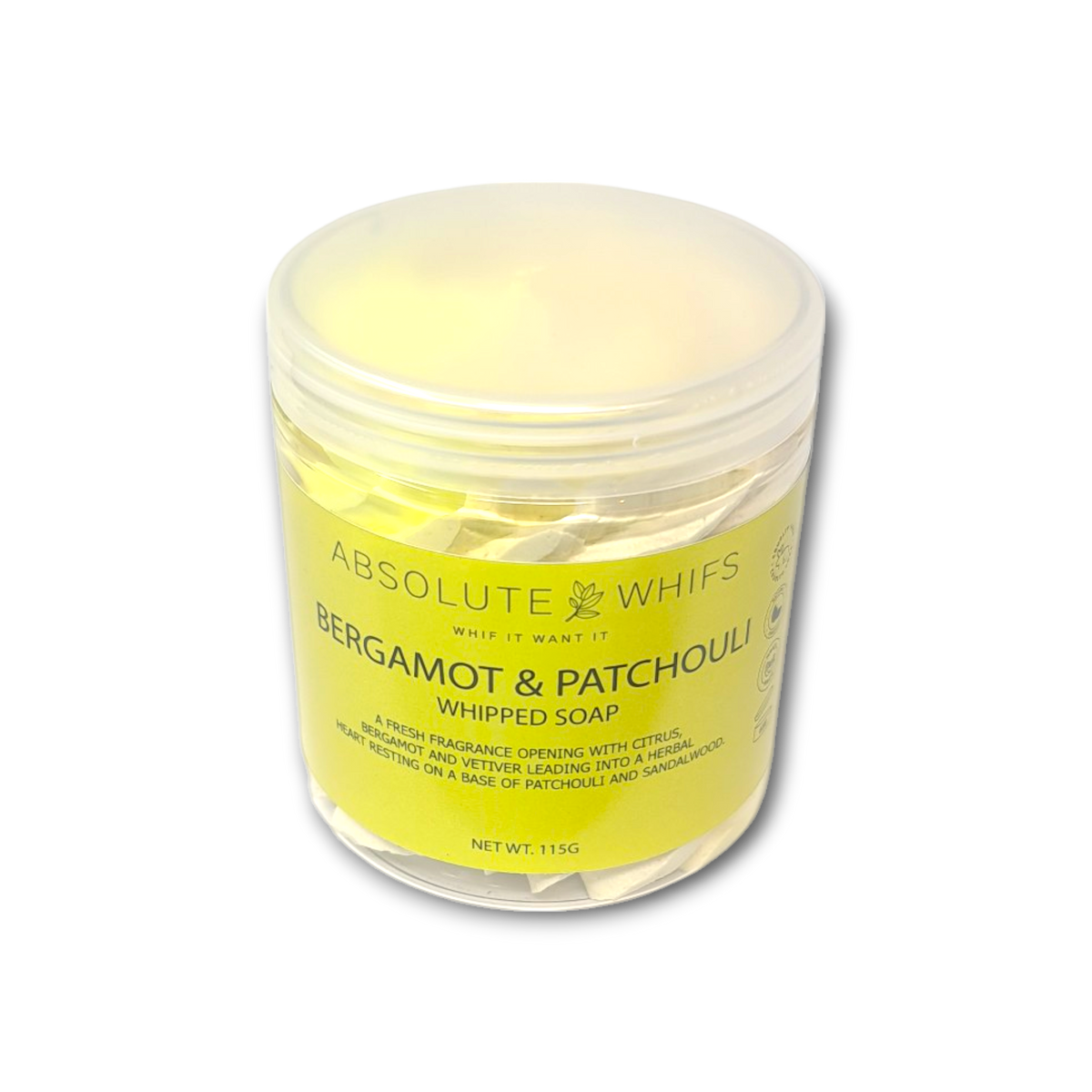 Bergamot and Patchouli whipped soap in translucent plastic jar with pale yellow label and creamy whipped butter texture inside
