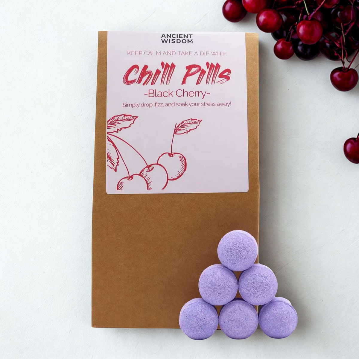 Black Cherry Chill Pills Gift Pack 350g in kraft packaging with a pink cherry label and lavender bath pills
