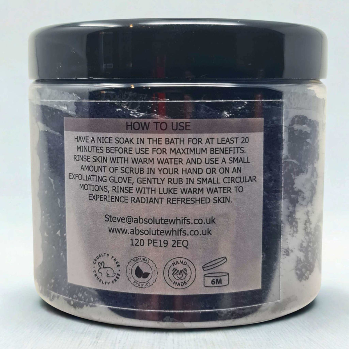 Black Citrus Sugar Body Scrub jar with clear container, black lid, and usage instructions label on the back