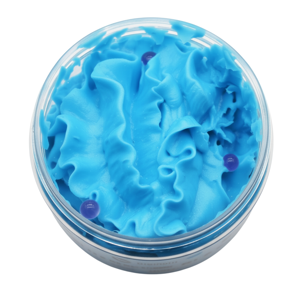 Blueberry Whipped Soap in bright blue fluffy swirls with visible dark blueberry pieces in a clear round container
