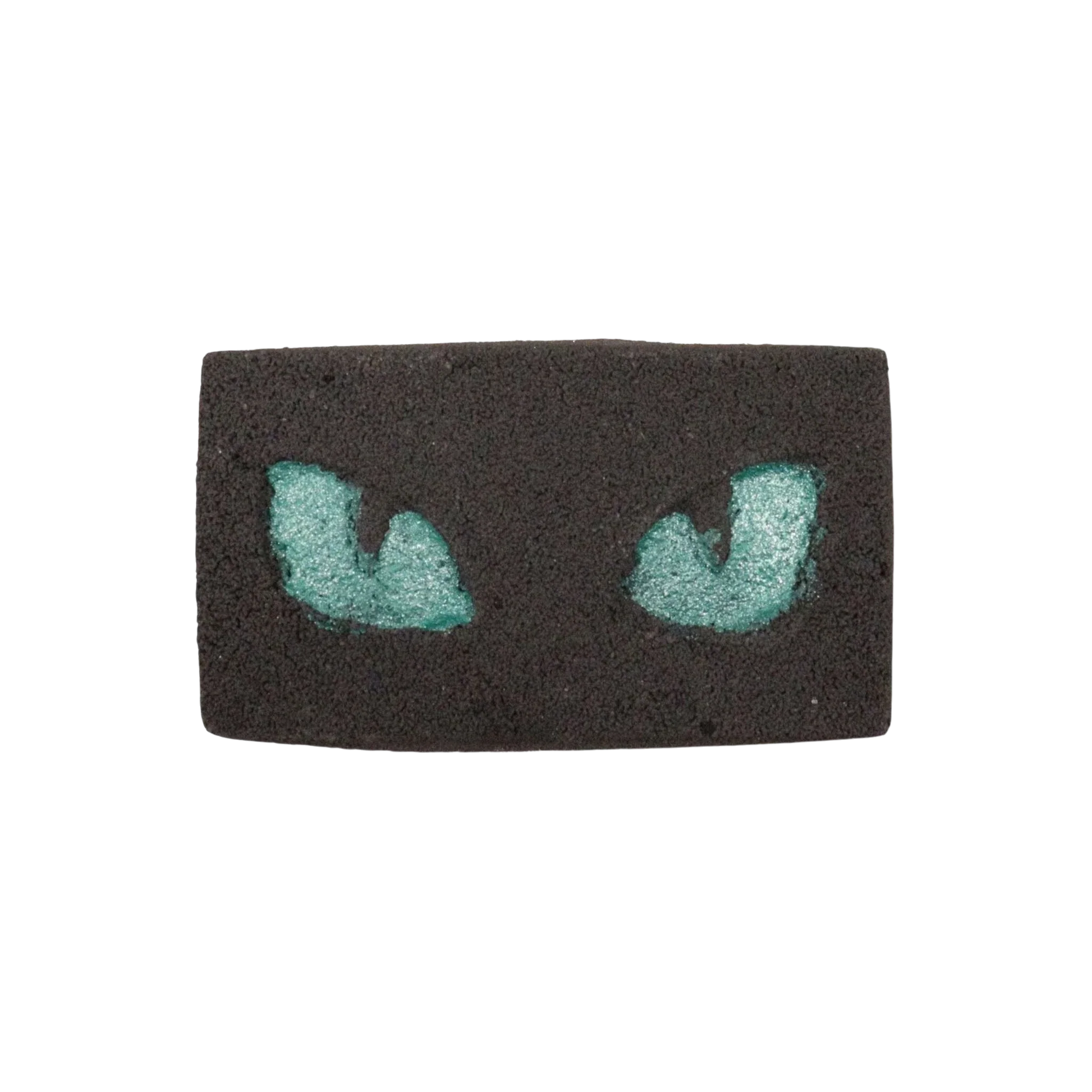 Cats Eyes Halloween Bath Bomb with glowing teal cat eyes in black base