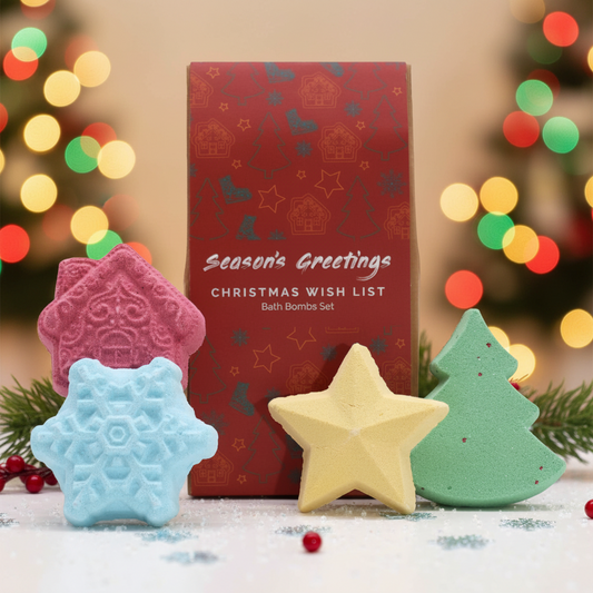 Christmas Bath Bomb Gift Pack featuring festive-shaped bath bombs in red, blue, yellow, and green against a decorative red box