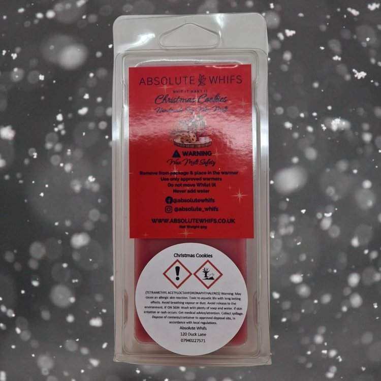 Christmas Cookie Wax Melt Snap Bar in red wax with warning labels and branding from Absolute Whifs in clear plastic clamshell packaging