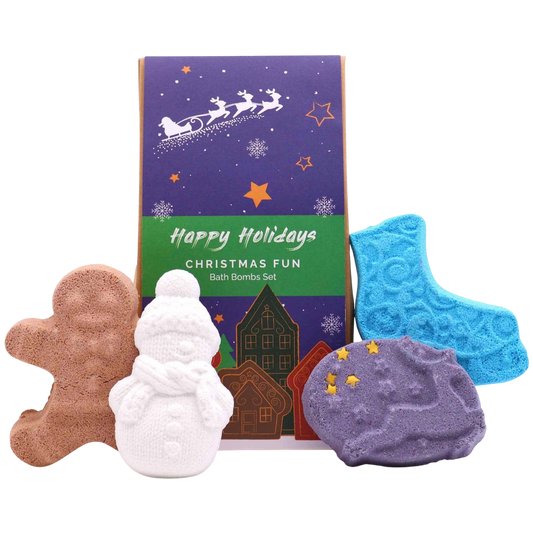 Christmas Fun Bath Bomb Gift Pack with festive shaped bath bombs including gingerbread man, snowman, crescent moon, and star in brown, white, purple, and blue colors