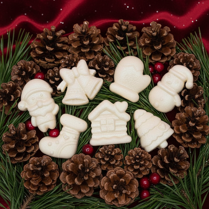 Christmas themed scented wax melts with Santa, bell, snowman, stocking, glove, cabin, and tree designs for festive home fragrance