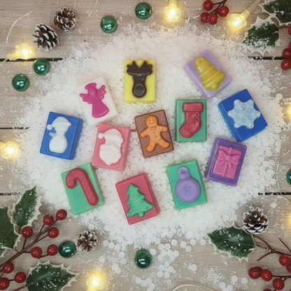 Christmas Wax Melts in vibrant colors with festive shapes like Santa, gingerbread, tree, candy cane, snowman, and stocking on white sprinkles