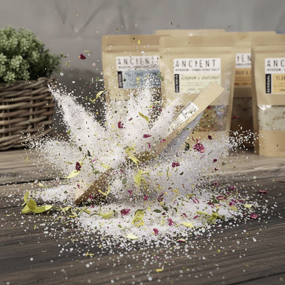 Clarity Himalayan Bath Salt blend with white mineral crystals, dried rose petals, herbs, and botanical pieces