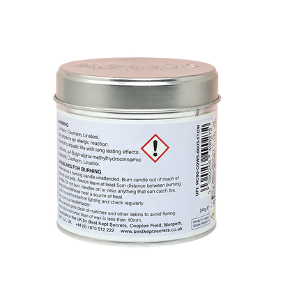 Classic Cotton Seriously Scented Candle in a small round silver metal tin with hazard and warning labels on the back
