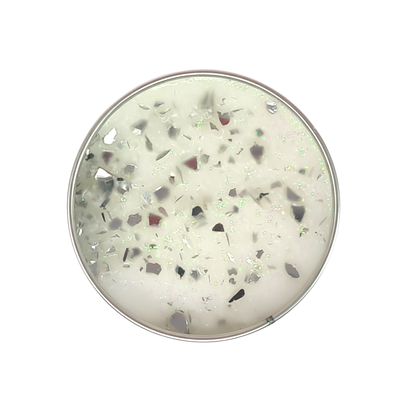 Classic Cotton Seriously Scented Candle with white wax and iridescent glittery and silver flake toppings in a round container