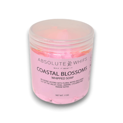 Coastal Blossoms Whipped Soap in a clear jar with soft pink whipped texture and floral marine notes label