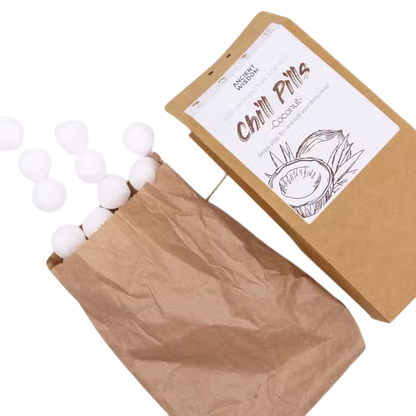 Coconut Chill Pills Gift Pack in brown paper packaging with white coconut-scented bath pills and illustrated label