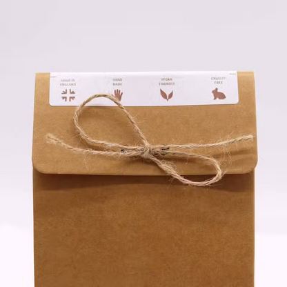 Coconut Chill Pills Gift Pack in a kraft paper box with a twine bow and vegan, cruelty-free labels