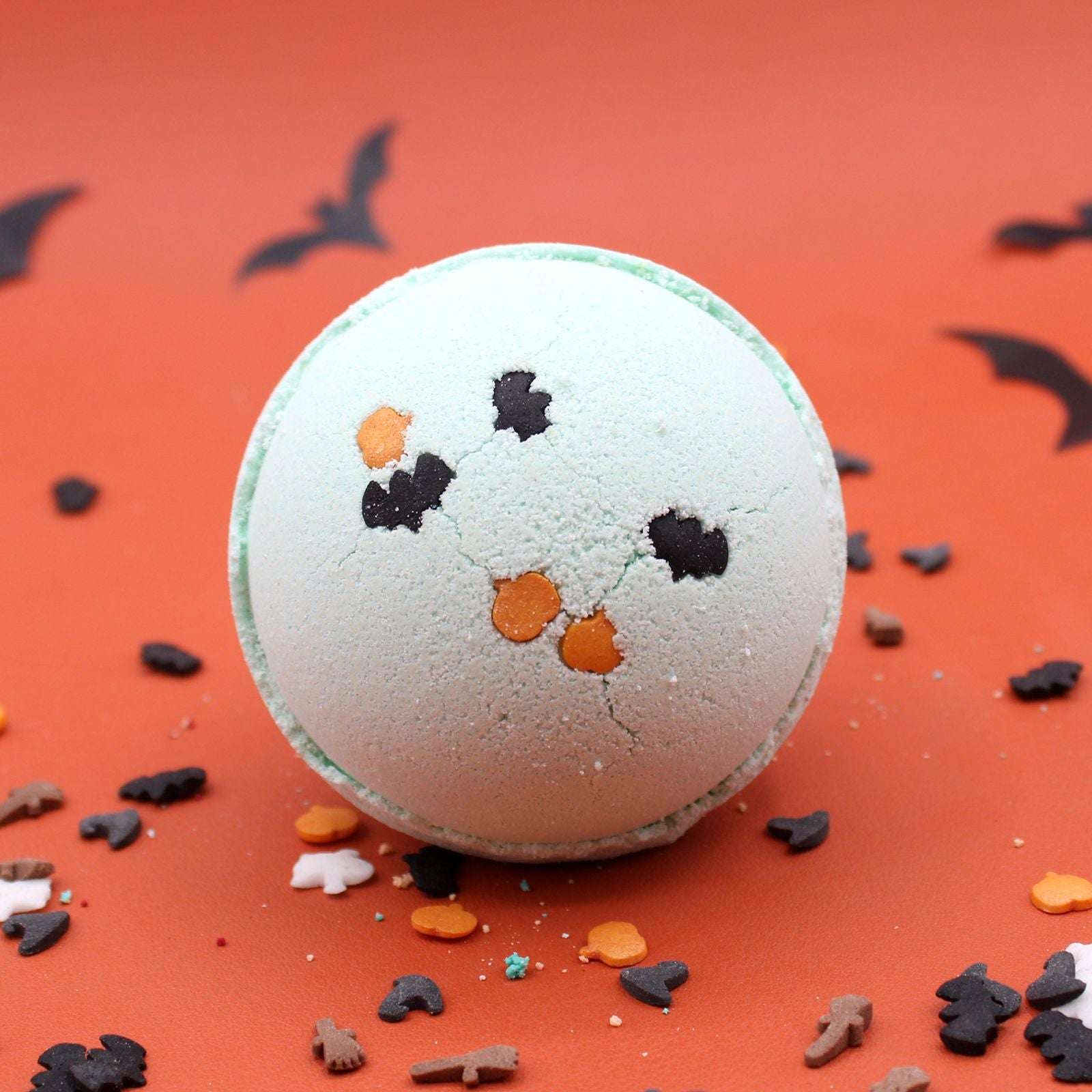 Handmade vegan coconut and lime Halloween bath bomb with vibrant colors