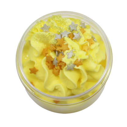 Cosy Winter Nights Whipped Soap in a clear jar, yellow whipped texture with silver and gold star sprinkles