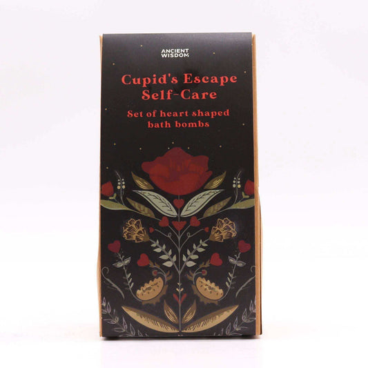 Cupids Escape Self Care black box with red and gold floral design featuring heart shaped bath bombs set text on front