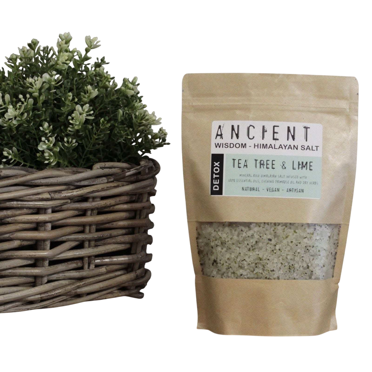 Detox Himalayan Bath Salt in a kraft pouch with visible tea tree and lime label and herb-speckled salt blend