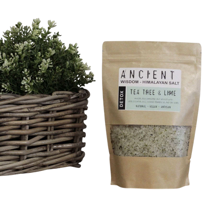 Detox Himalayan Bath Salt in a kraft pouch with visible tea tree and lime label and herb-speckled salt blend