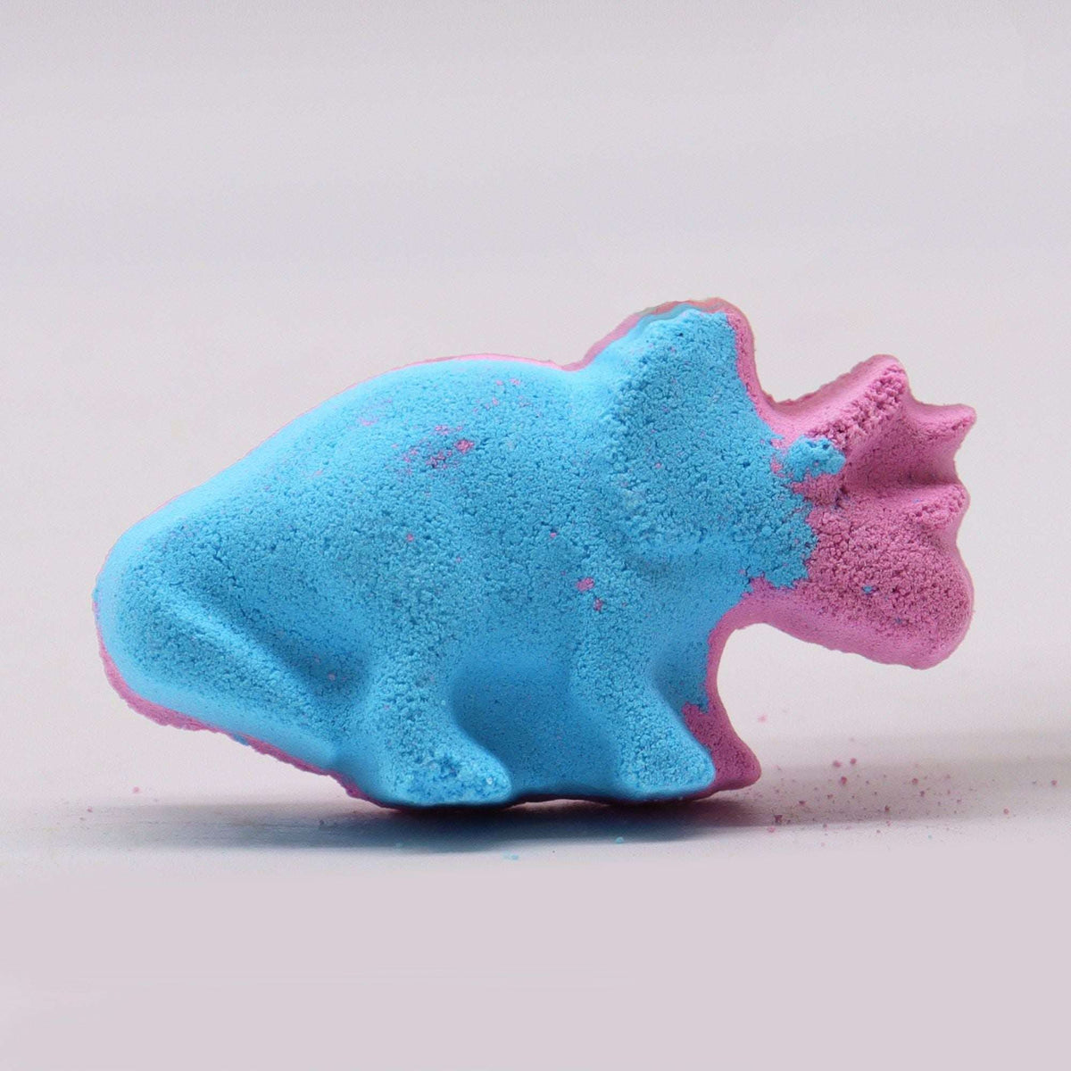 Dinosaur Bath bomb shaped like a triceratops in blue and pink with a textured surface and detailed features