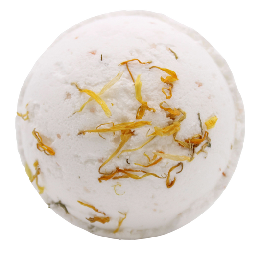 Energise Himalayan Salt Bath Bomb in white with dried yellow flower petals embedded on the surface, round and textured
