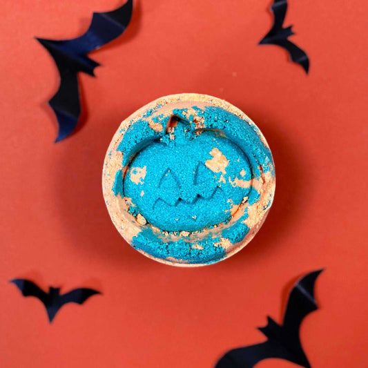 Handmade vegan fennel and orange Halloween bath bomb with vibrant colors
