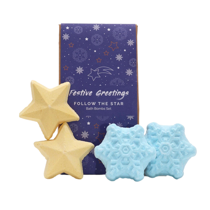Follow the Star Christmas Bath Bomb Gift Pack featuring yellow star-shaped and blue snowflake-shaped bath bombs with festive packaging