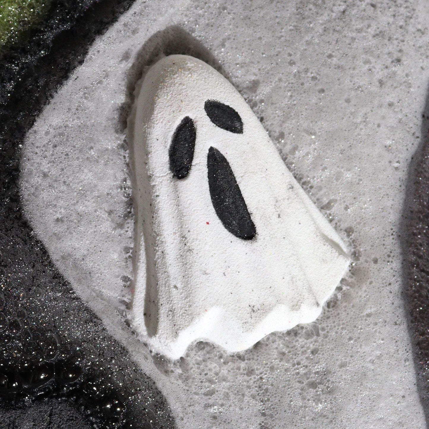 Ghost Halloween bath bomb fizzing in water