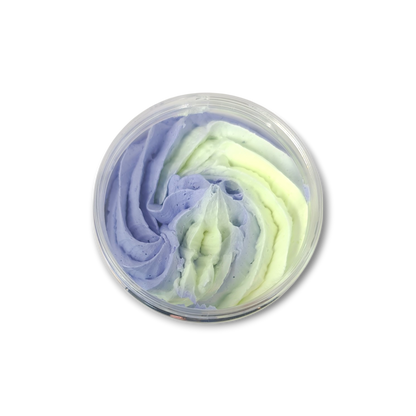 Lemon Lavender Whipped Soap in a transparent jar featuring swirled light purple and pale yellow creamy texture