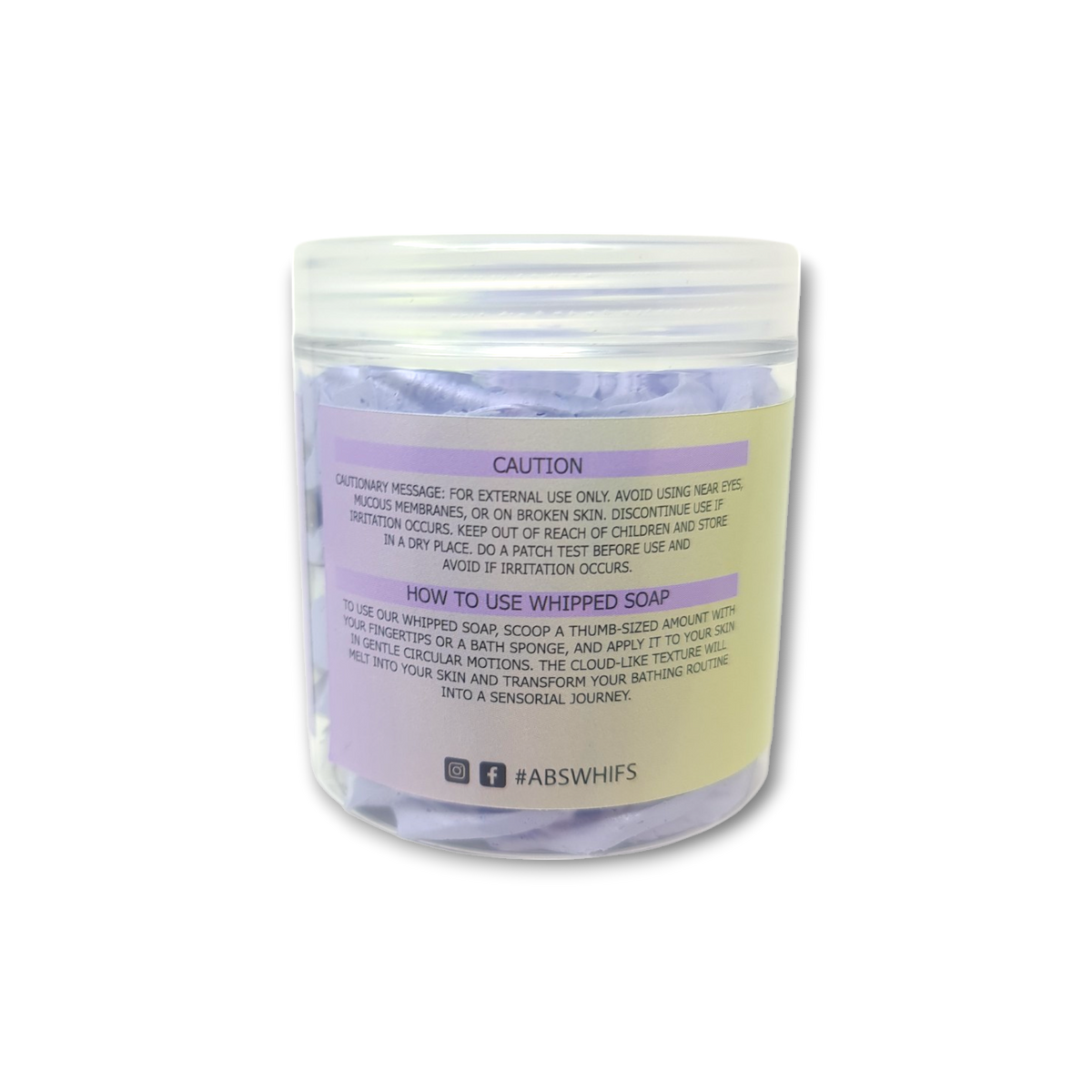 Lemon Lavender Whipped Soap in a transparent jar with pale yellow label and light purple whipped texture visible inside