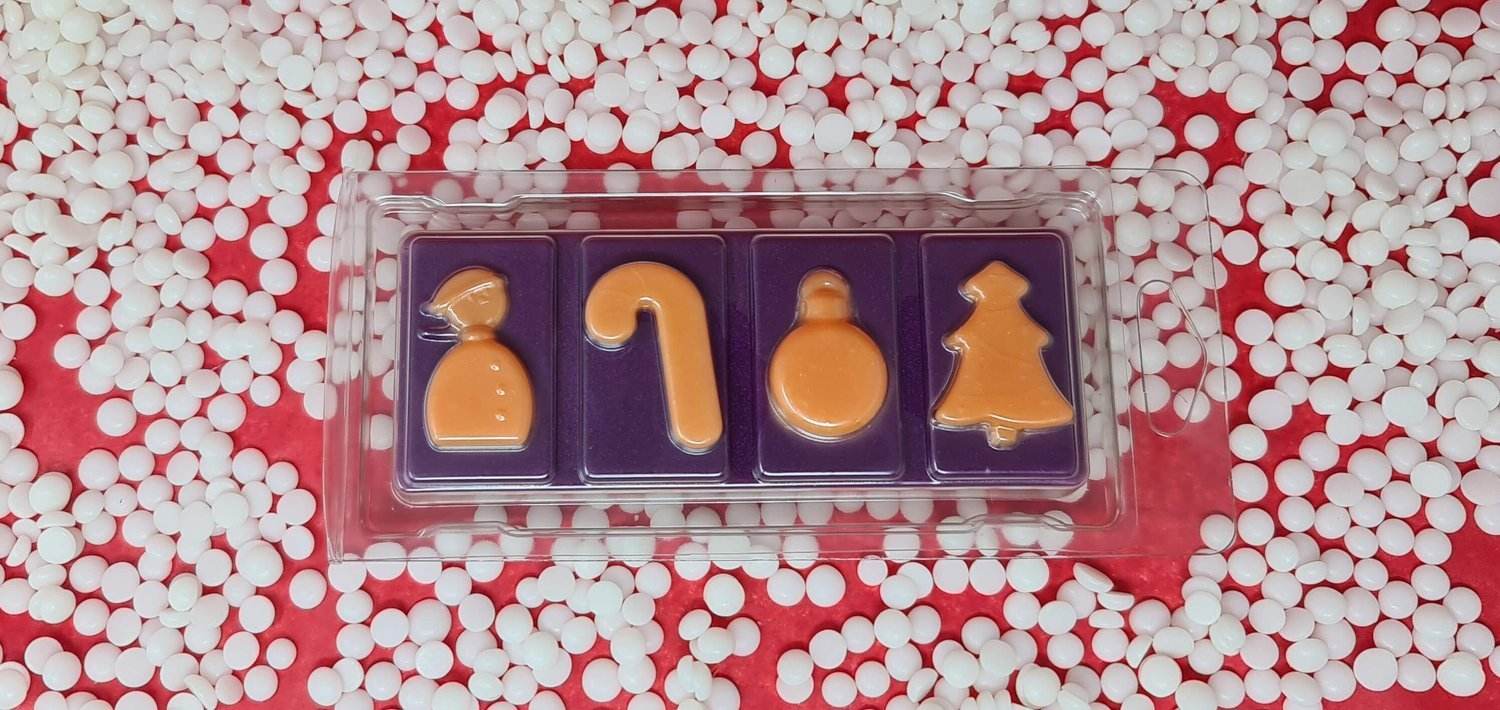 Mulled Wine Wax Melt Snap Bar with festive shapes surrounded by white pellets.