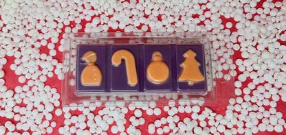 Mulled Wine Wax Melt Snap Bar with festive shapes surrounded by white pellets.