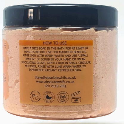Peach and Papaya Sugar Body Scrub in clear round jar with black lid showing pink whipped butter texture and usage instructions label