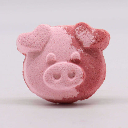 Pig Bath bomb in pink shades with a pig face design and textured surface, ideal for a single-use bath